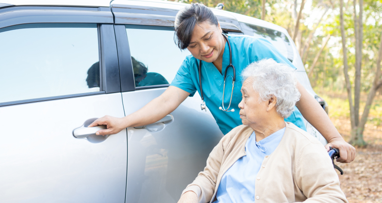 Help and support asian senior or elderly old lady woman patient sitting on wheelchair prepare get to her car, healthy strong medical concept.